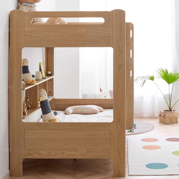 Scandinavian oak wood kids bunk bed with wall shelf hive with context.