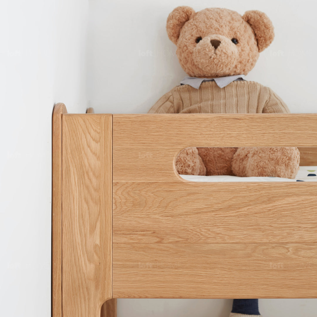 Scandinavian oak wood kids bunk bed with wall shelf hive in details.