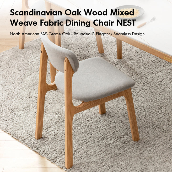 Scandinavian oak wood mixed weave fabric dining chair nest in real life style.