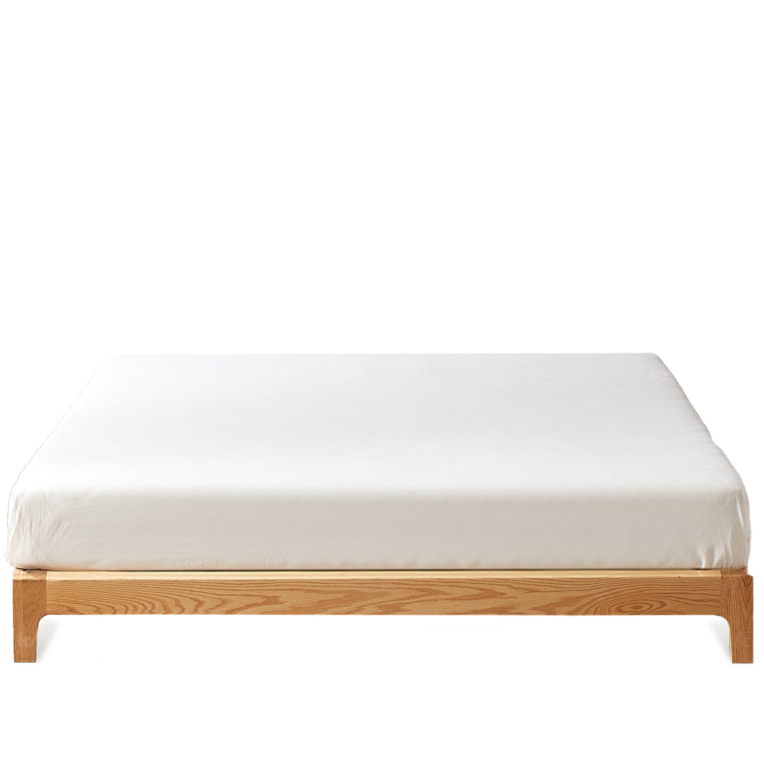 Scandinavian oak wood platform bed etude in white background.