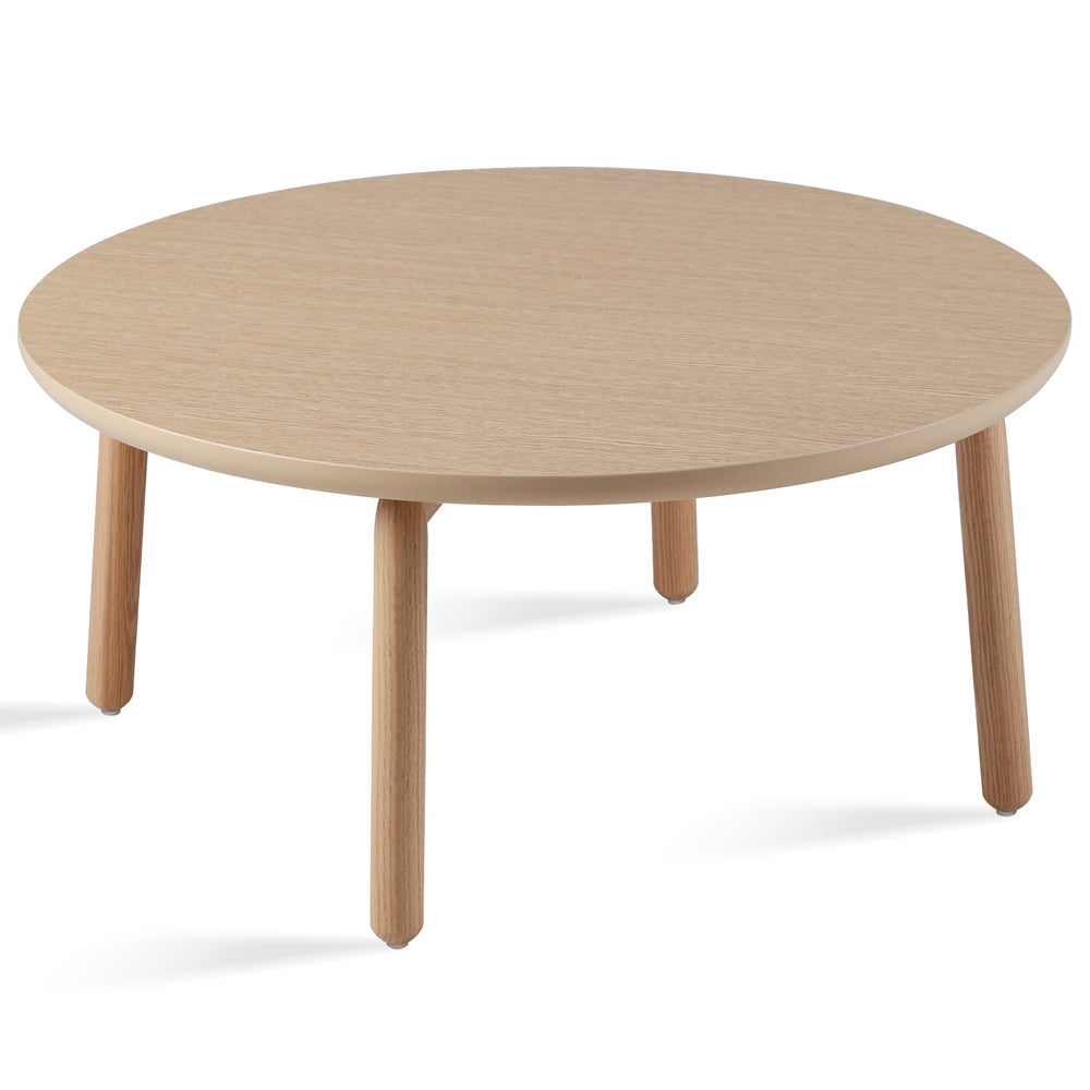 Scandinavian oak wood round coffee table may in white background.