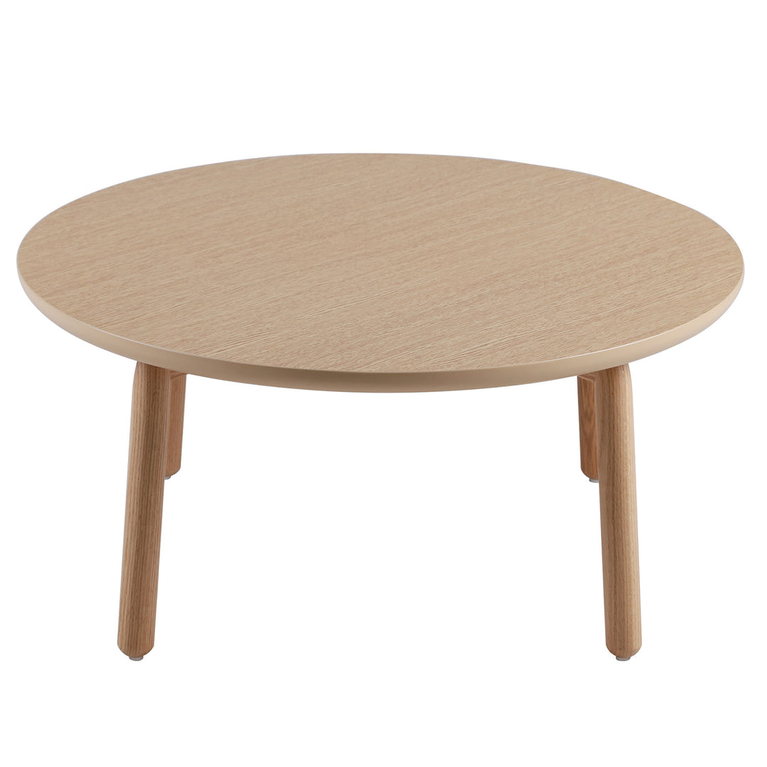 Scandinavian oak wood round coffee table may in close up details.