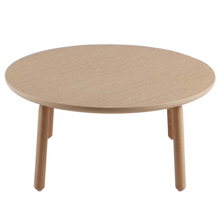 Scandinavian oak wood round coffee table may in close up details.