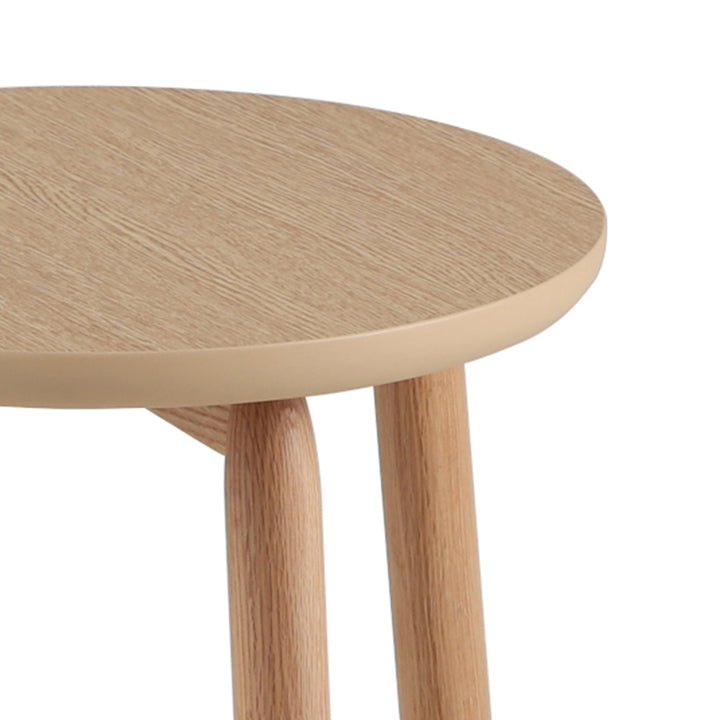 Scandinavian oak wood side table may with context.