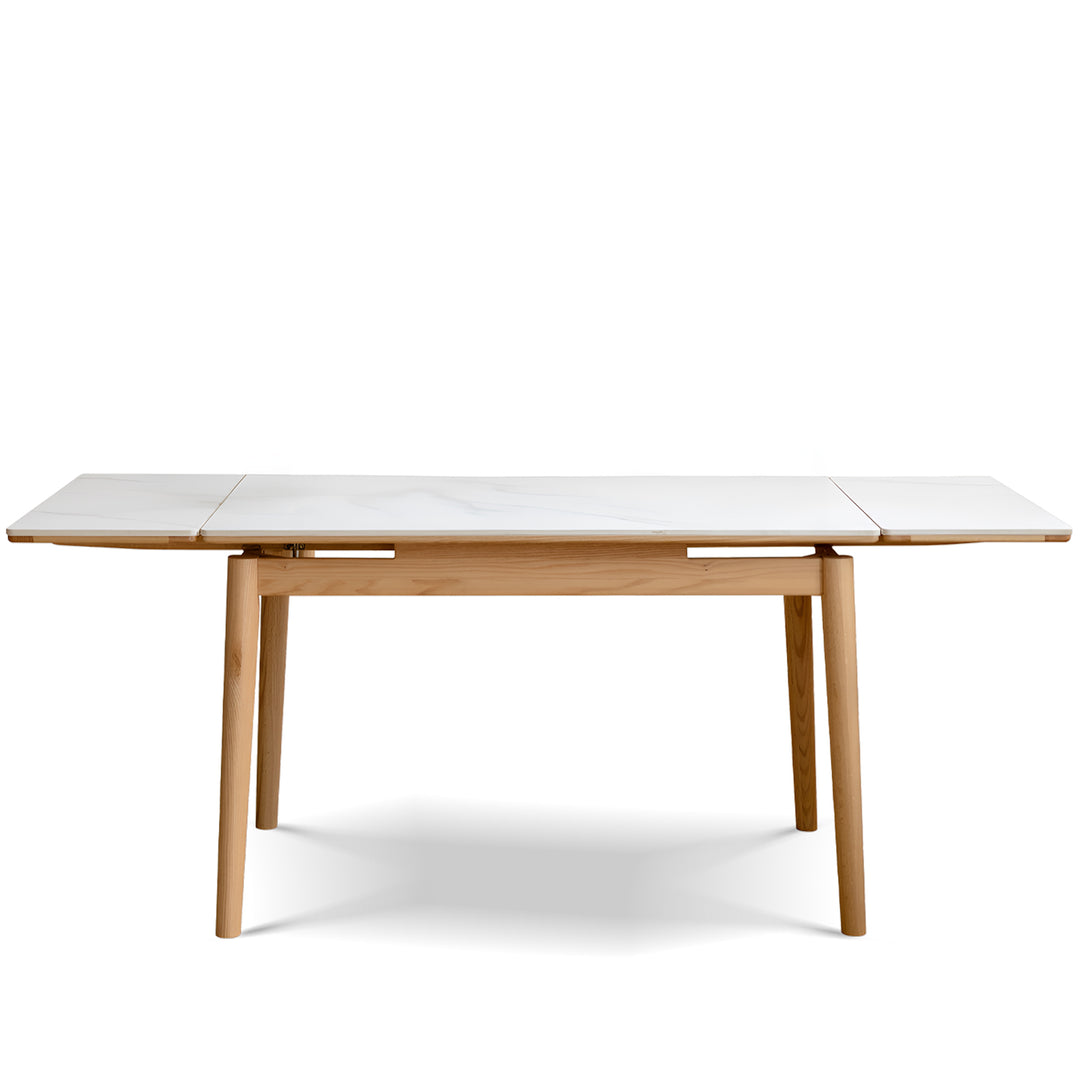 Scandinavian oak wood sintered stone extendable dining table flex in white background.