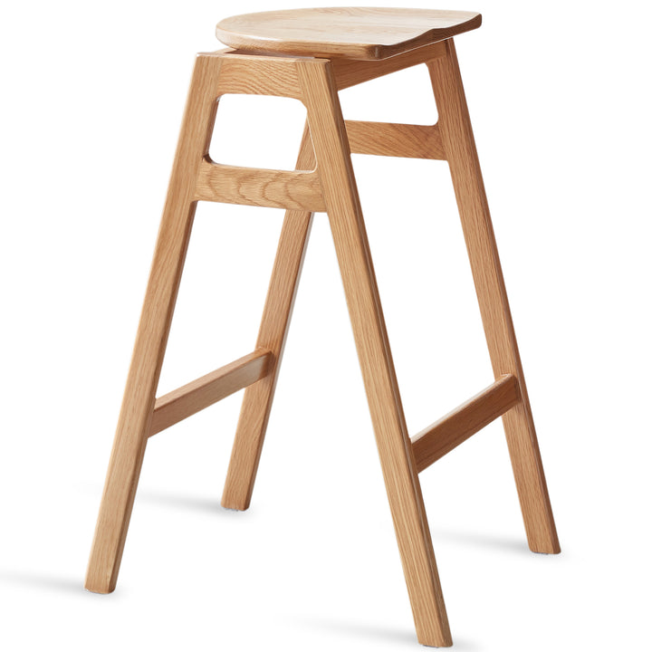 Scandinavian oak wood stackable bar stool stacko in white background.