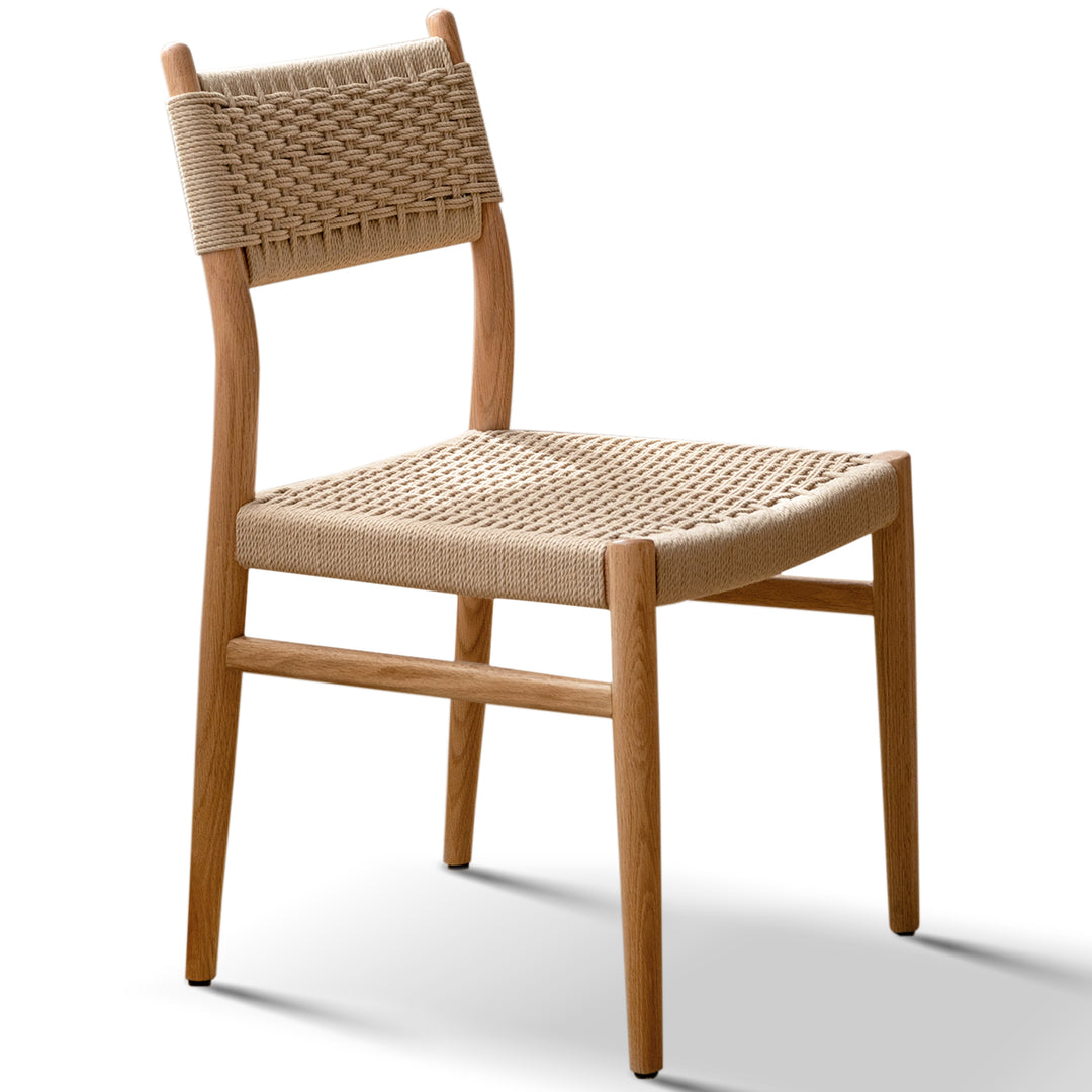 Scandinavian oak wood woven dining chair weave in white background.