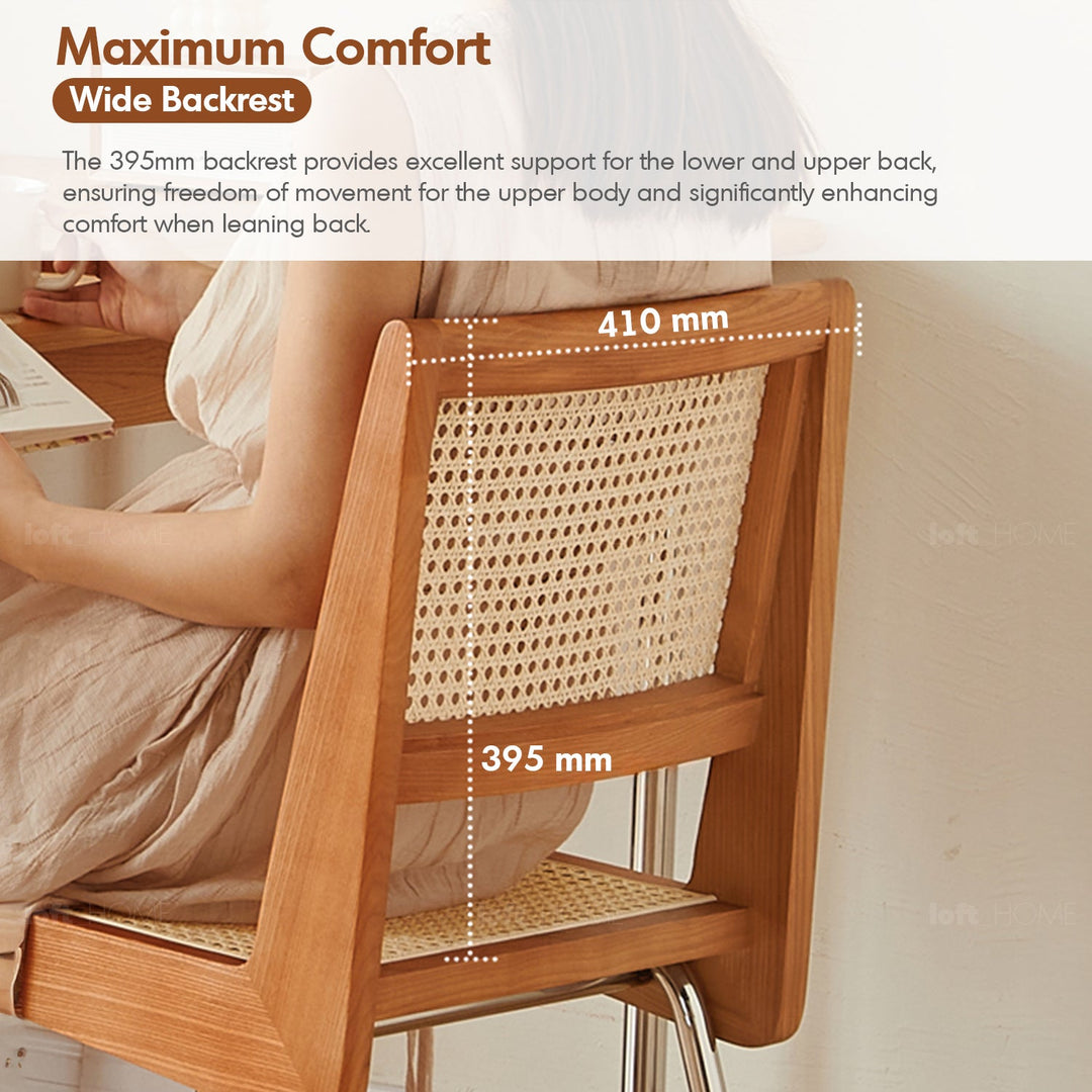 Scandinavian rattan cherry wood dining chair prime in details.