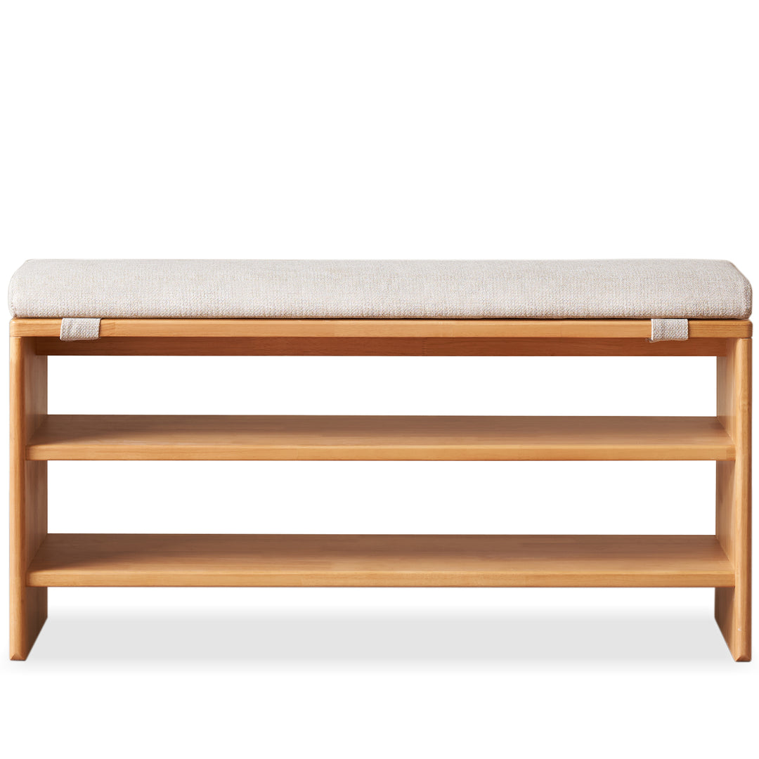 Scandinavian rubber wood shoe shelf footstool bench with cushion sit in white background.