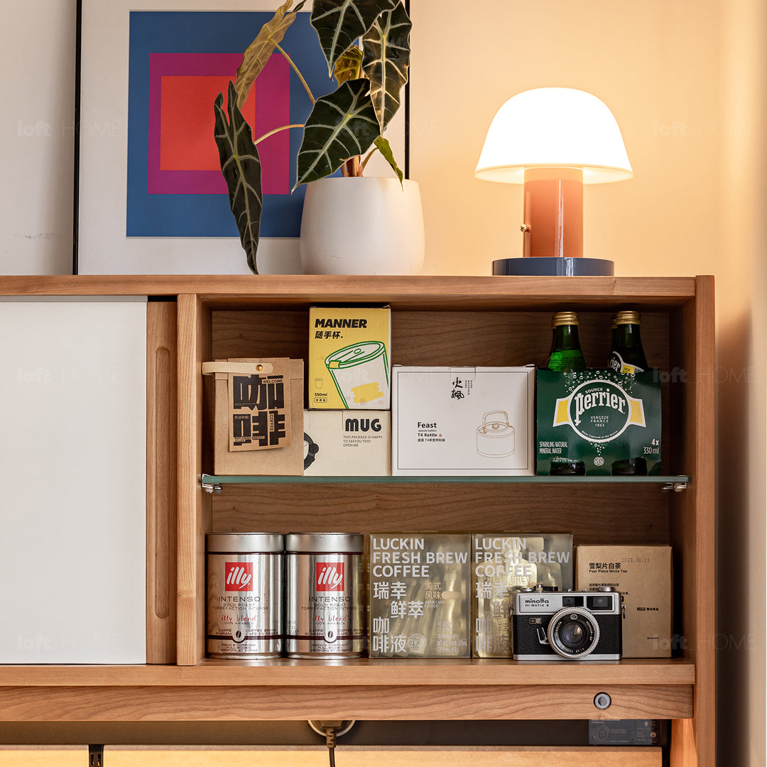 Scandinavian cherry wood sintered stone storage side cabinet timeless material variants.