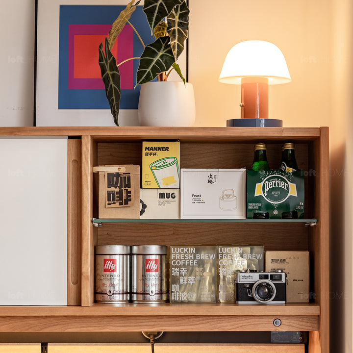 Scandinavian cherry wood sintered stone storage side cabinet timeless material variants.