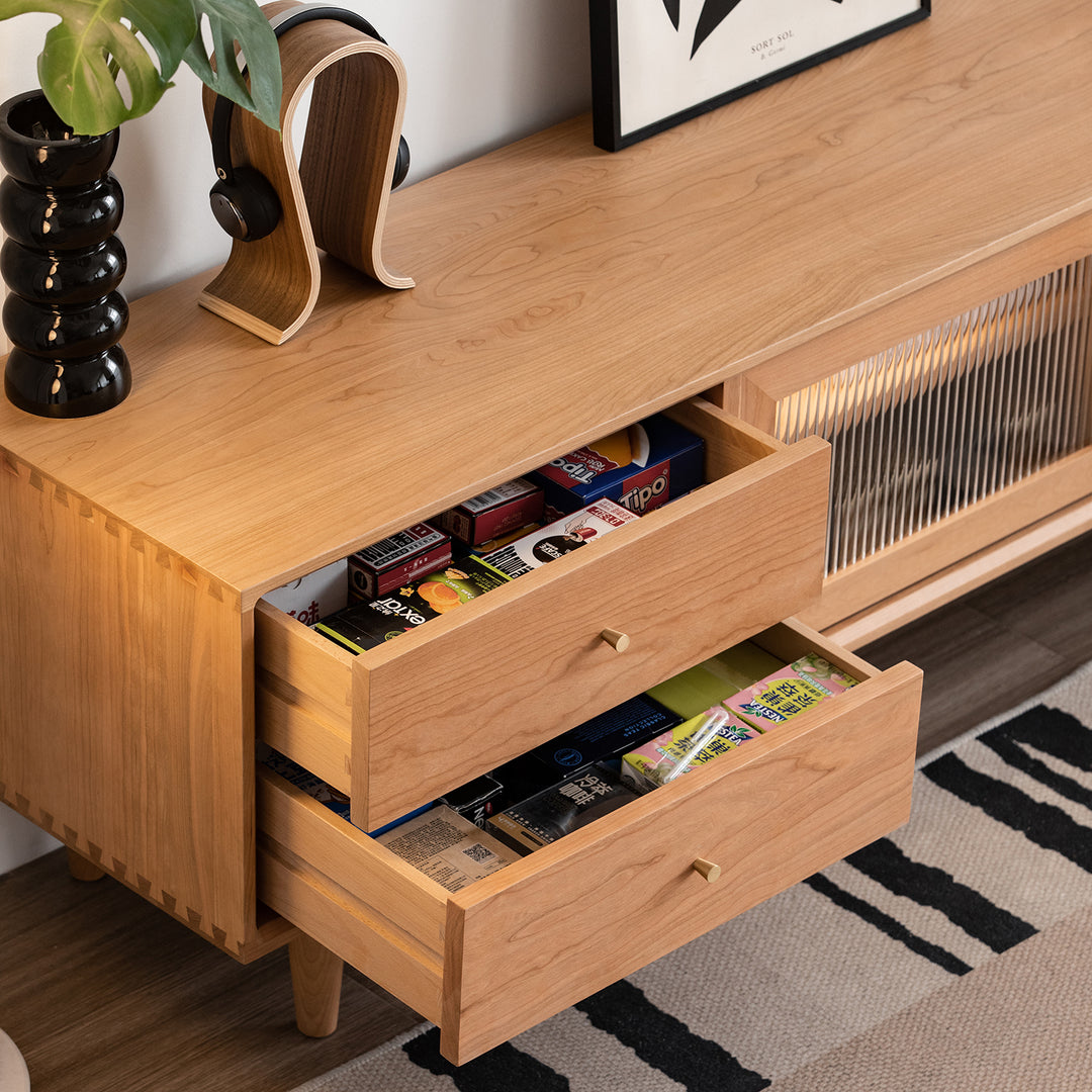 Scandinavian cherry wood tv console green in still life.