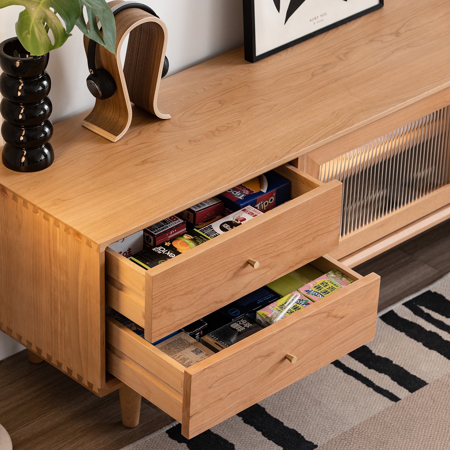 Scandinavian cherry wood tv console green in still life.