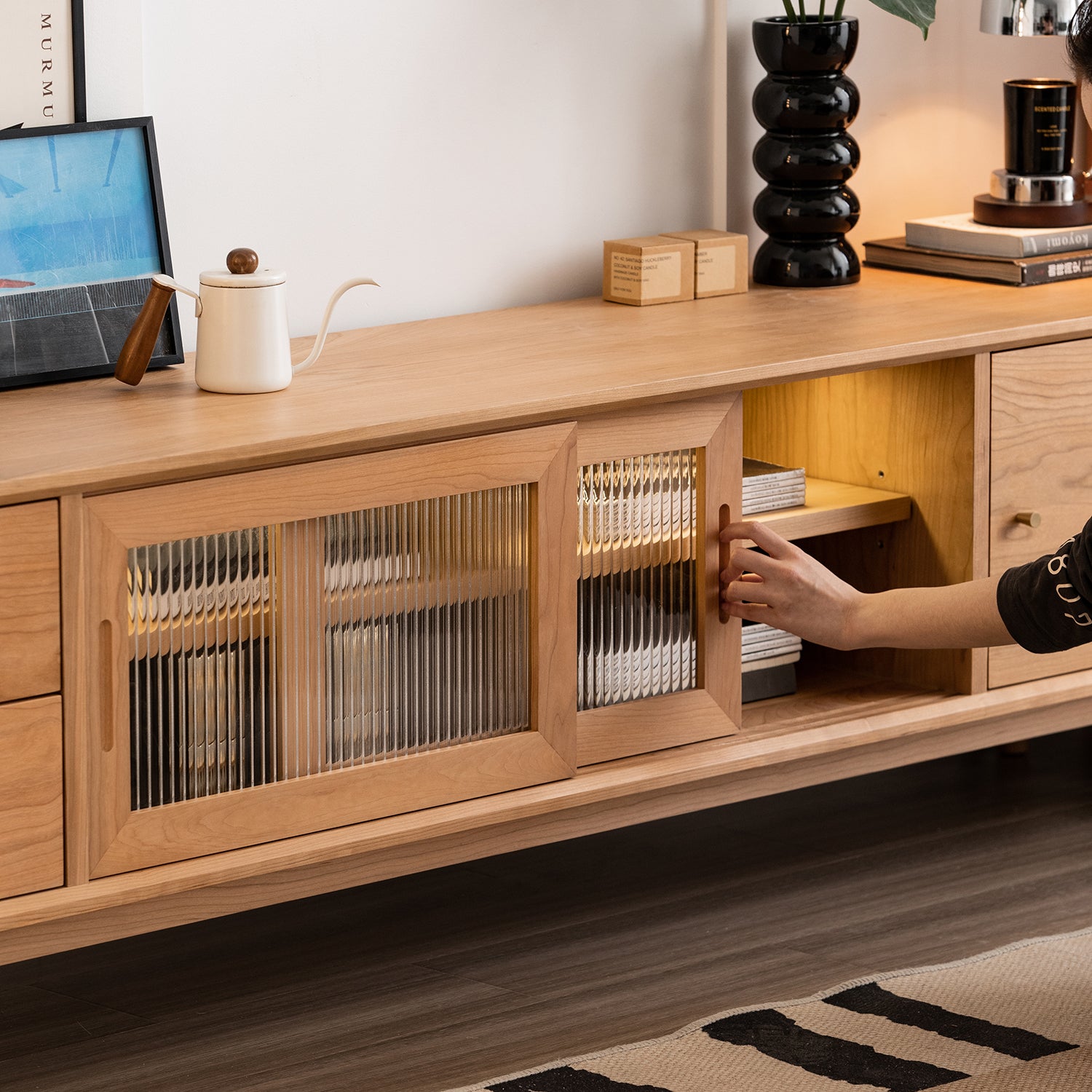 Scandinavian cherry wood tv console green with context.