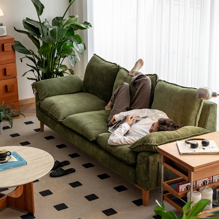 Scandinavian corduroy velvet fabric 3 seater sofa indigo in still life.