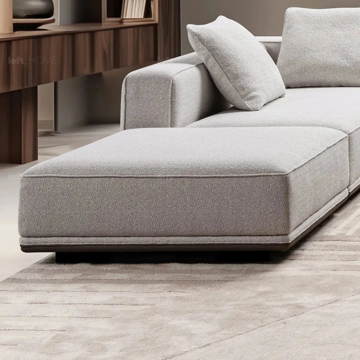 Minimalist mixed weave fabric modular ottoman eleganza in real life style.