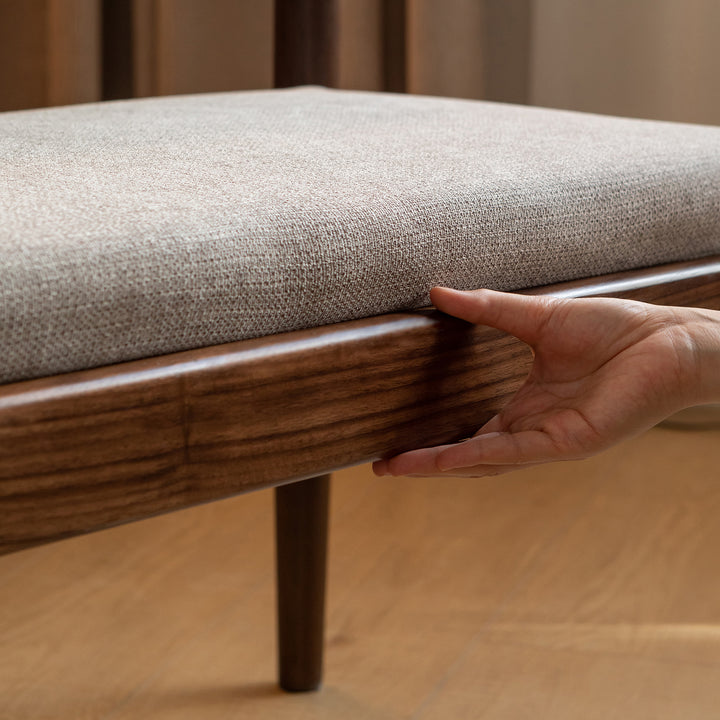 Scandinavian oak wood mixed weave fabric dining bench pillar walnut in close up details.
