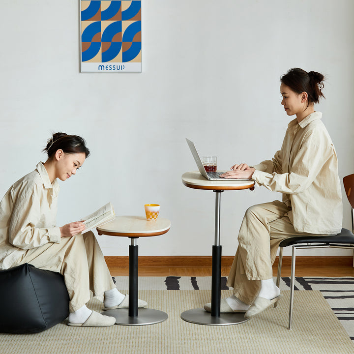 Scandinavian sintered stone height adjustable side table roman in panoramic view.