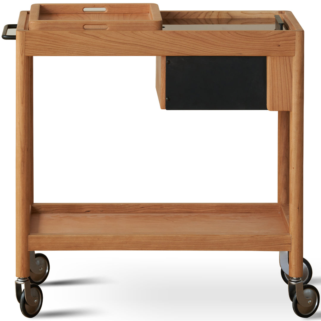 Scandinavian cherry wood wheeled trolley side table pocket in white background.