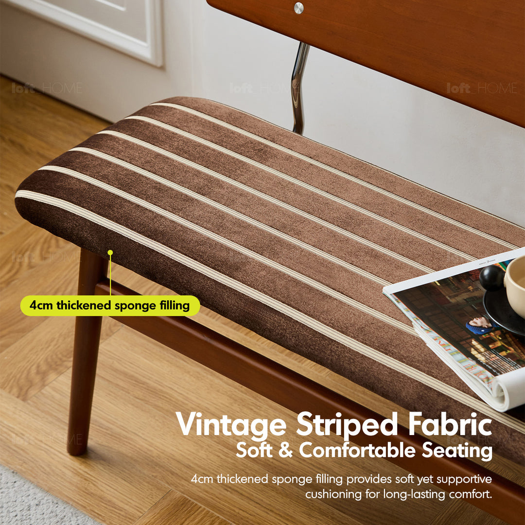 Vintage boxwood mix weave fabric cushion dining bench truffle in panoramic view.
