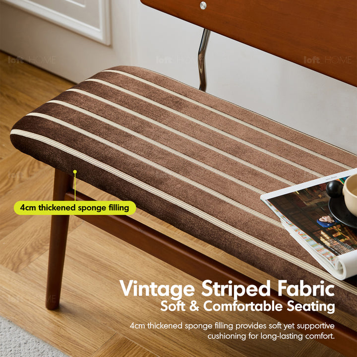 Vintage boxwood mix weave fabric cushion dining bench truffle in panoramic view.