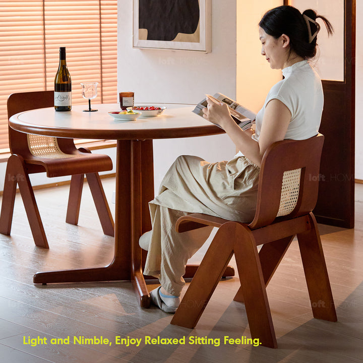 Vintage boxwood rattan dining chair fanko in panoramic view.