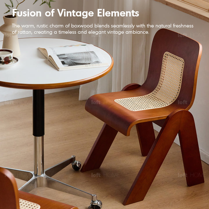 Vintage boxwood rattan dining chair fanko in close up details.