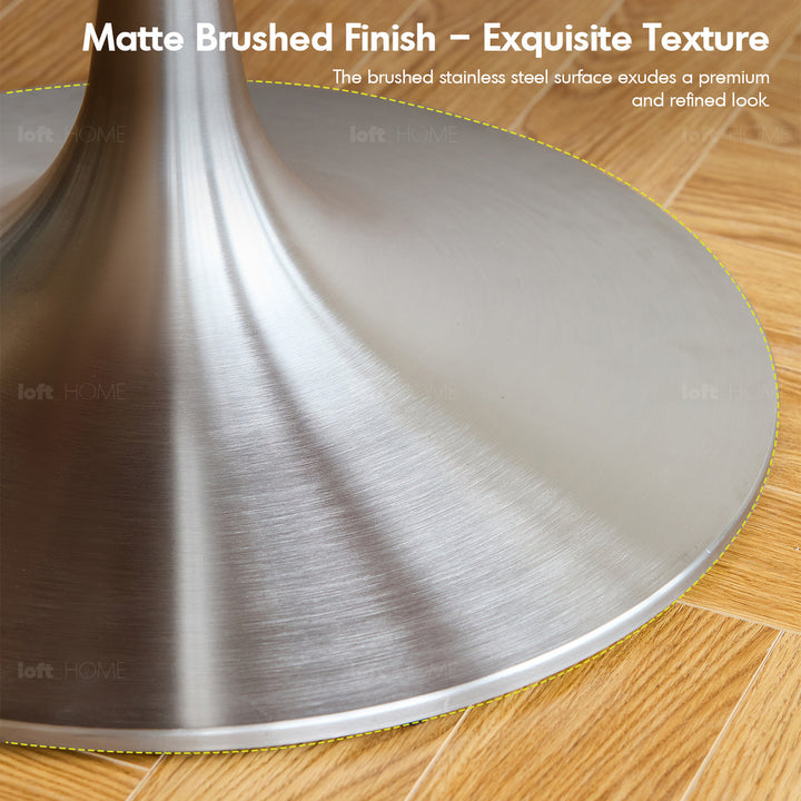 Vintage boxwood stainless steel round dining table tulip in panoramic view.
