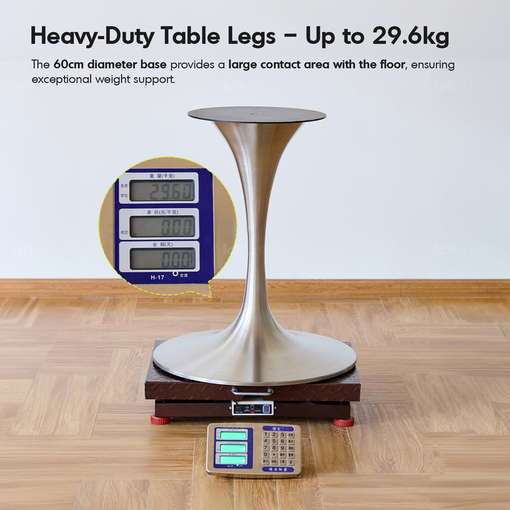 Vintage boxwood stainless steel round dining table tulip in close up details.