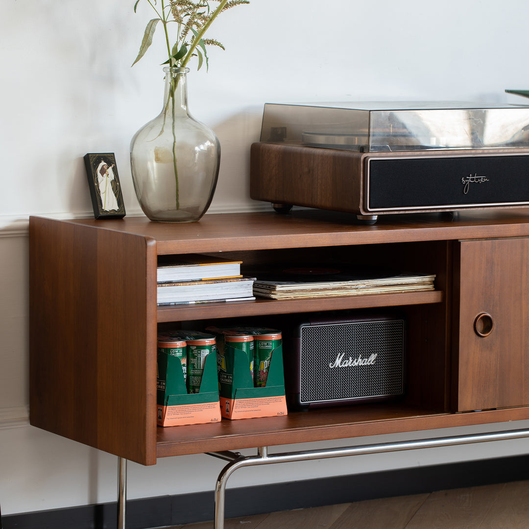 Vintage boxwood tv console silver salt in close up details.