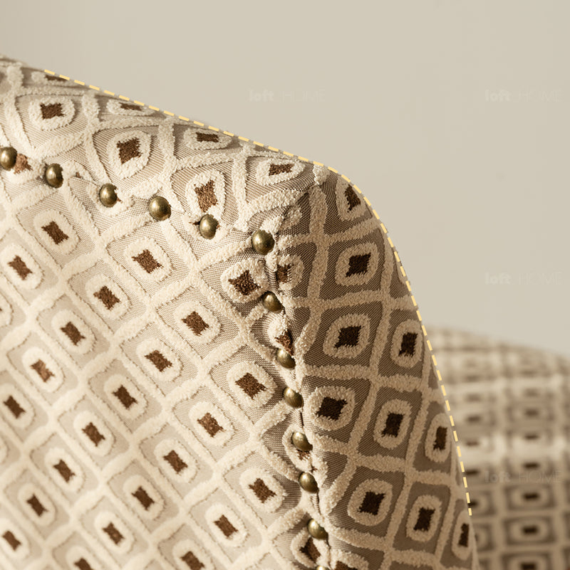Vintage mixed weave fabric 1 seater sofa wheat in close up details.