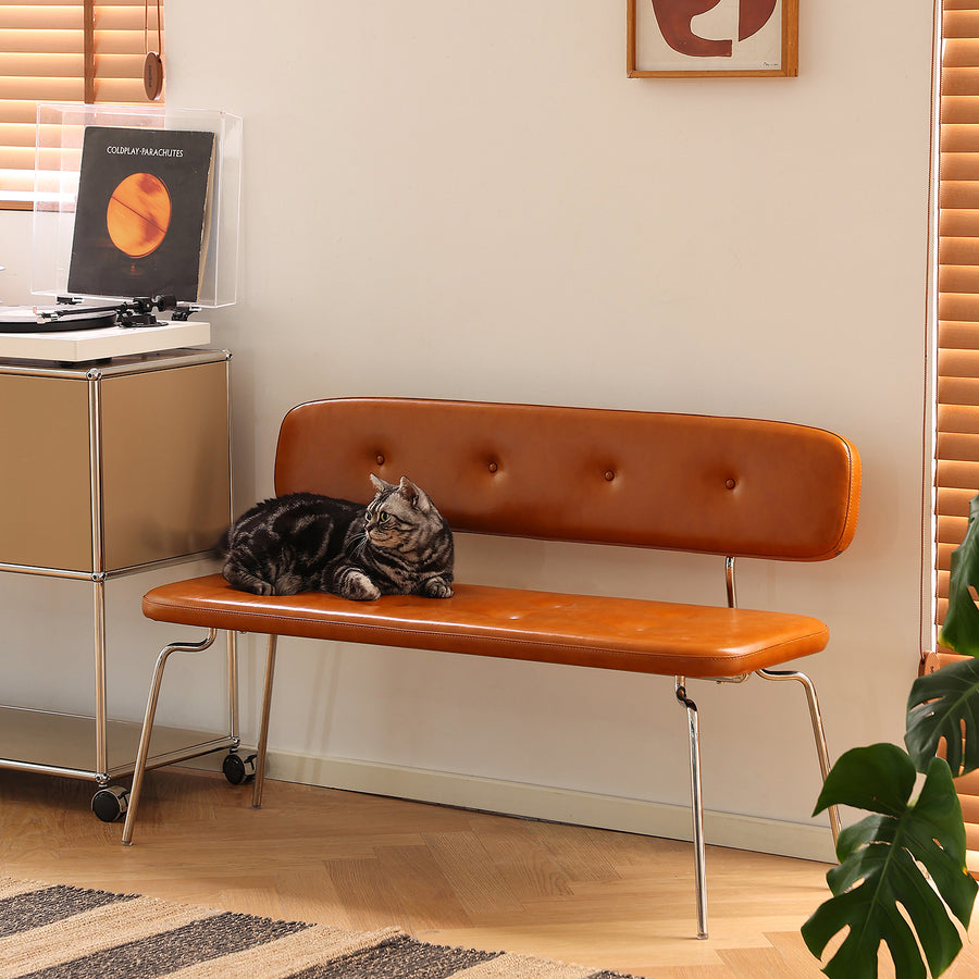 Vintage pu leather dining bench with backrest hera in white background.