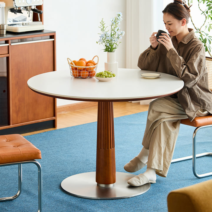 Vintage sintered stone round dining table grey in real life style.