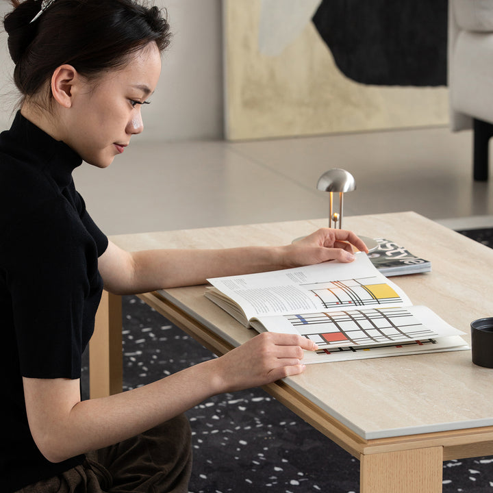 Minimalist ash wood veneer sintered stone coffee table string with context.