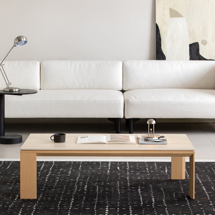 Minimalist ash wood veneer sintered stone coffee table string in close up details.