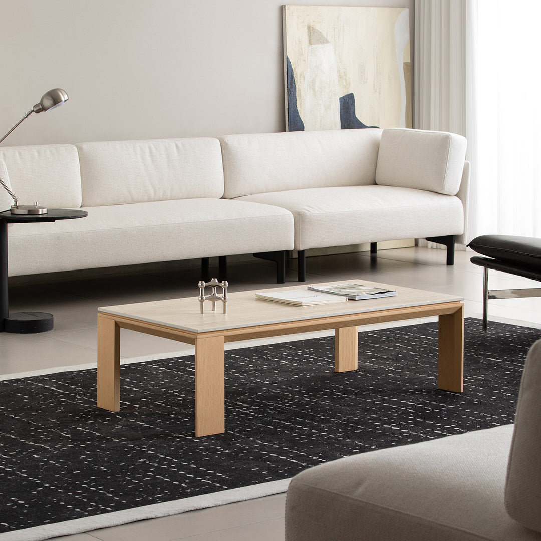 Minimalist ash wood veneer sintered stone coffee table string in panoramic view.