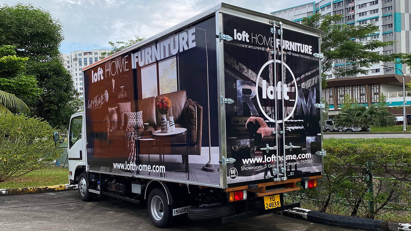 Loft Home Furniture delivery truck showcasing stylish furniture branding, offering free delivery services across Singapore.