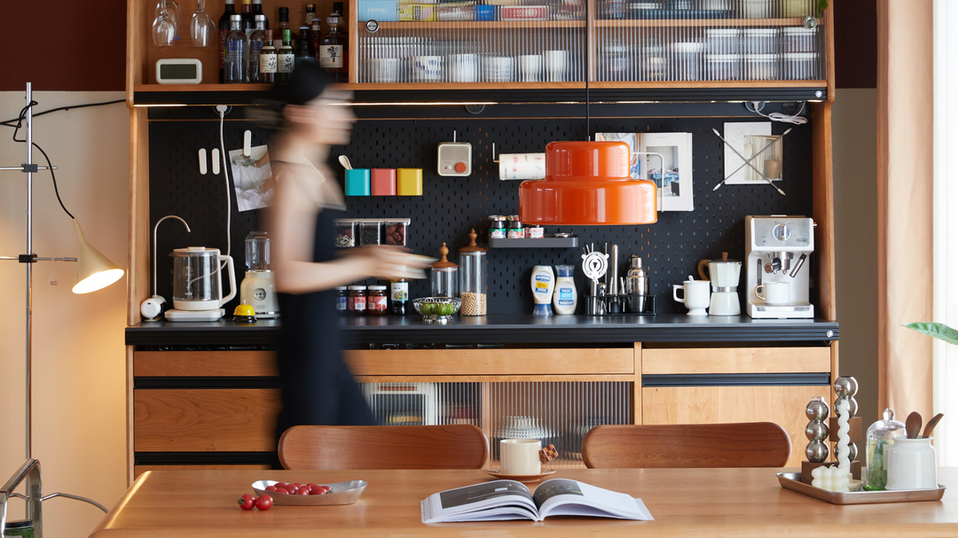 Loft Home kitchen featuring stylish wooden cabinetry, a modern coffee station, and vibrant decor elements.