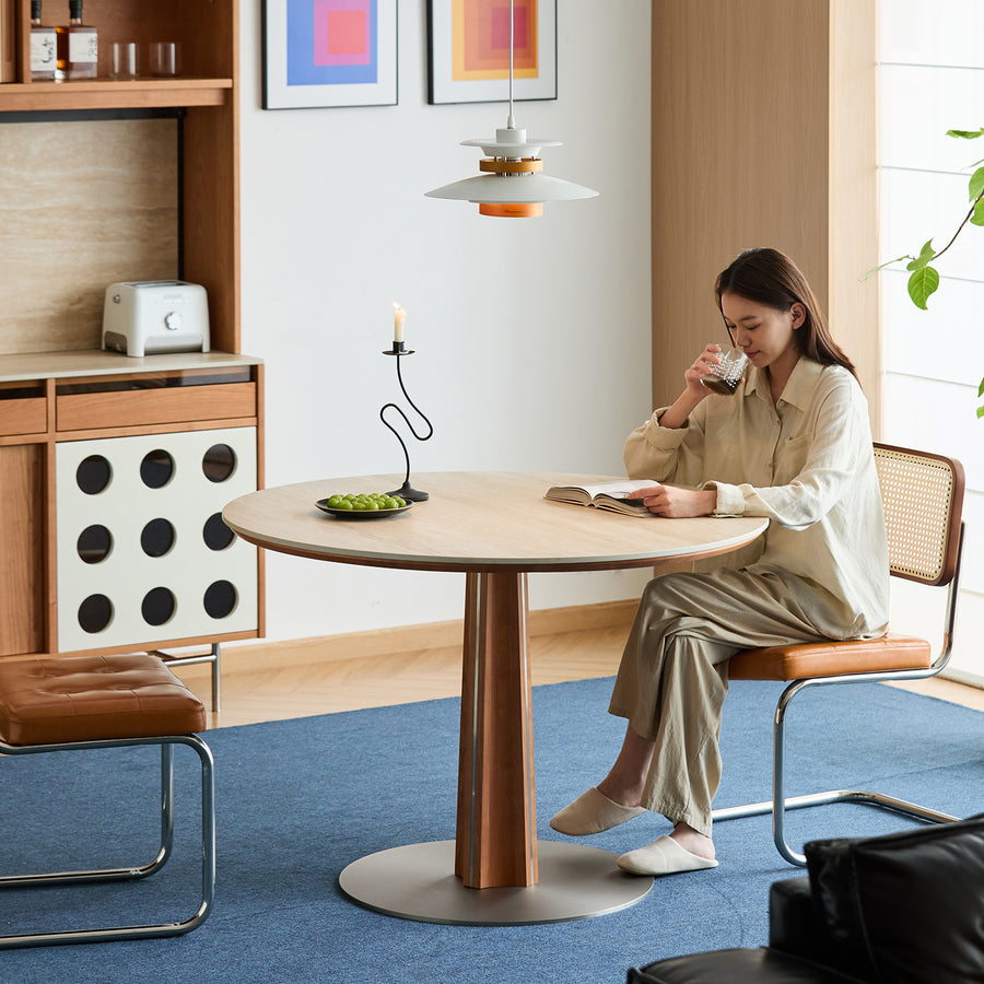 Bauhaus cherry wood sintered stone round dining table pinecone primary product view.