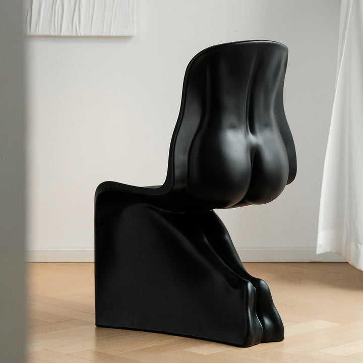 Bauhaus plastic dining chair her with context.