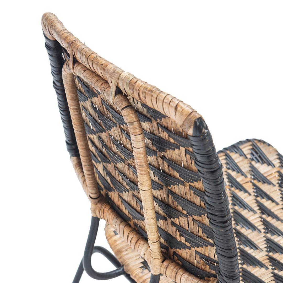 Bohemian rattan dining chair larry in panoramic view.