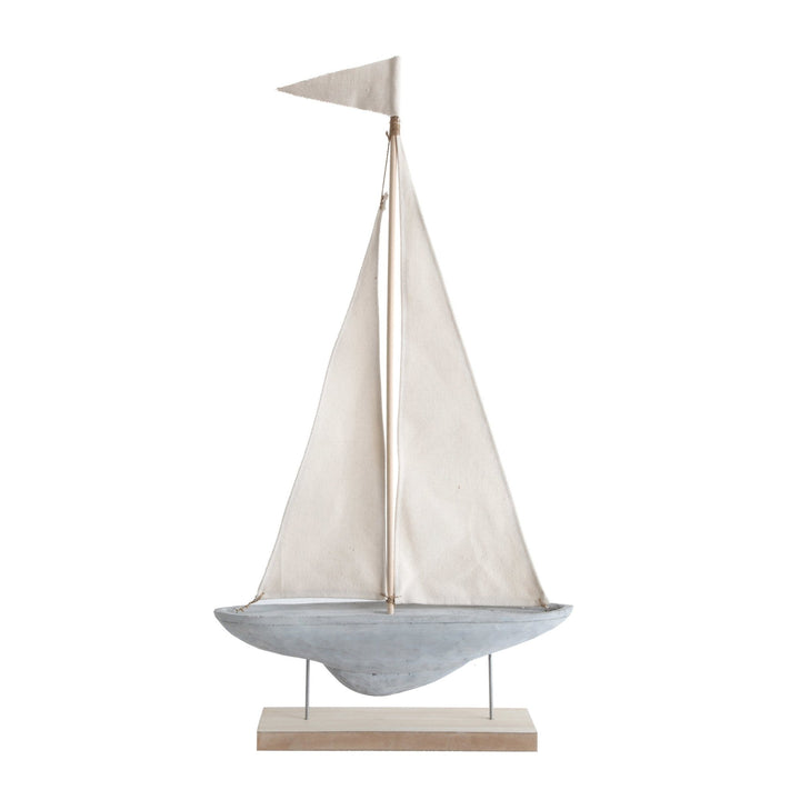 Cement & fabric boat decoration with stand in white background.