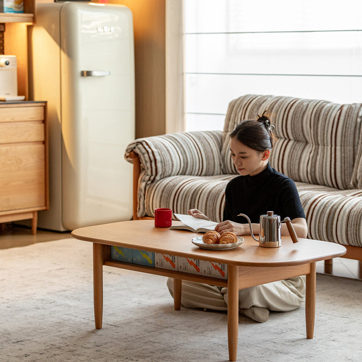 Scandinavian cherry wood coffee table vista in panoramic view.