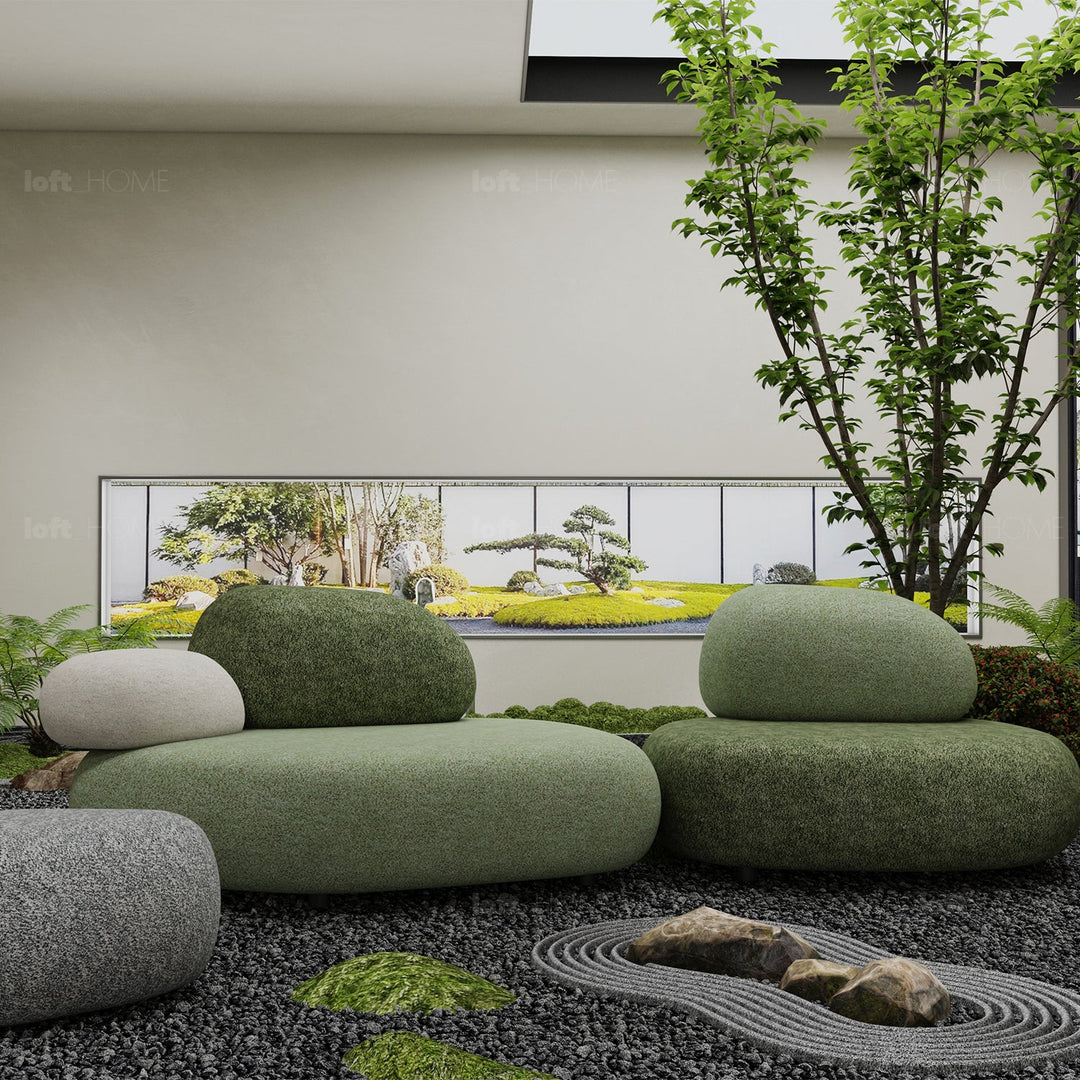 Contemporary fabric 1 seater sofa pebble in still life.