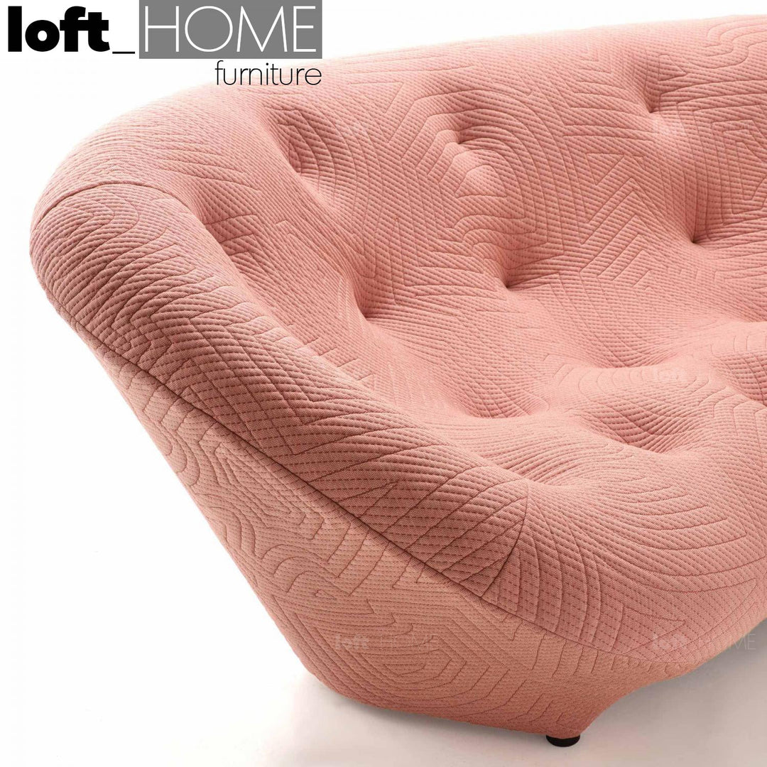Contemporary fabric 2 seater sofa conch appa in still life.