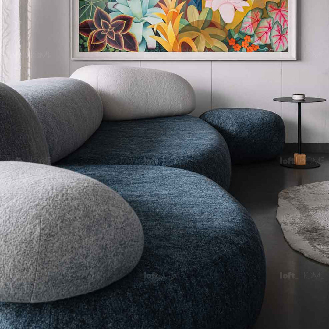 Contemporary fabric 2 seater sofa pebble chaise in panoramic view.