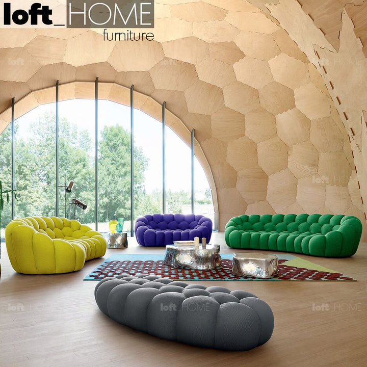 Contemporary fabric curved ottoman bubble in panoramic view.