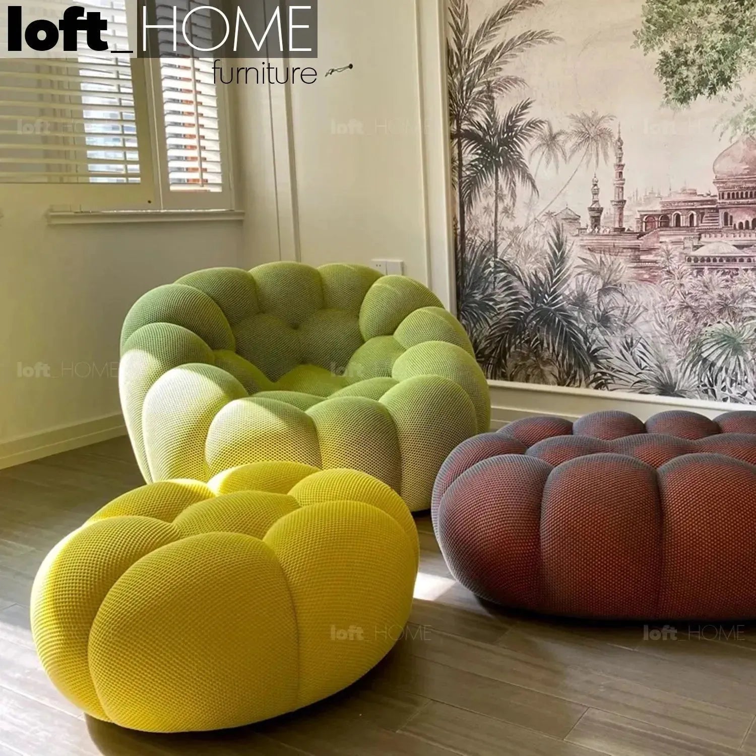 Contemporary fabric curved ottoman bubble in still life.
