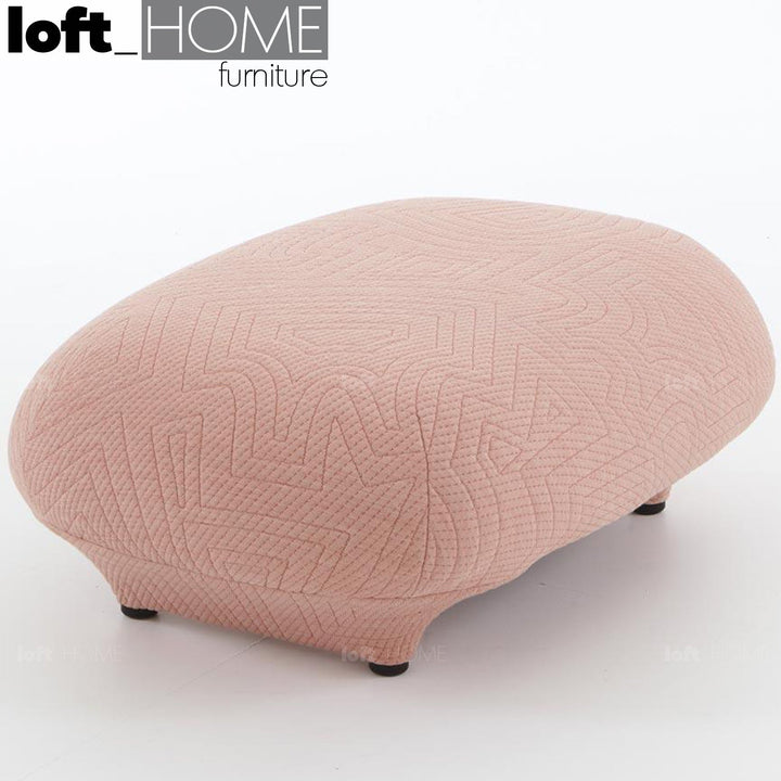 Contemporary fabric ottoman conch appa with context.