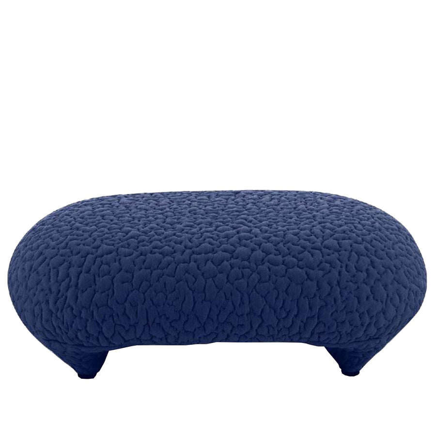 Contemporary fabric ottoman conch moby in white background.
